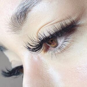 Lash lift and tint treatment for naturally curled and darkened lashes.